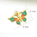 Detail view of a 2.6cm gold butterfly pendant with green and orange gradient enamel inlay - Green Orange Gradient Butterfly Style (02)