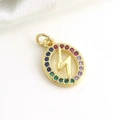 Macro detail of gold-plated lightning bolt pendant with colorful zircon stones on silk - Circle Lightning Pattern (7)