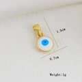 Detailed macro view of an 18K gold-plated Evil Eye pendant showing 1.5cm x 0.7cm dimensions - Round White Base Blue Eye Pendant (01)