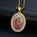 Macro view of gold-plated oval pendant featuring Jesus icon and sparkling zircon border - Jesus Portrait (Style A)