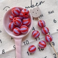 Macro detail of red and purple striped round beads for DIY handmade jewelry crafts - Style 28 Red Purple Striped 12mm