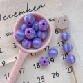 Detailed macro view of round purple and light blue striped resin beads for DIY jewelry - Style 26 Blue Purple Striped 12mm