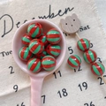 Close-up of red and green striped round beads for DIY jewelry with high gloss finish - Style 27 Red Green Striped 12mm