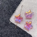 Macro detail of iridescent star-shaped glass beads for DIY jewelry making - Rose Pink Star
