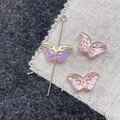 Macro detail of iridescent butterfly resin beads with wing textures for DIY jewelry making - Pink Butterfly