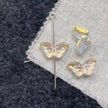 Detail view of butterfly glass beads with iridescent finish for DIY jewelry crafts - Yellow Butterfly