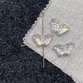 Detailed view of iridescent butterfly glass beads with vertical drill hole for DIY jewelry - White Butterfly