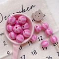 Close-up of pink striped circus style round acrylic beads for DIY jewelry making - Style 11 Pink Striped 12mm