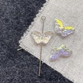 Macro shot of iridescent aurora butterfly glass beads for DIY jewelry making and crafts - Pale Yellow Butterfly