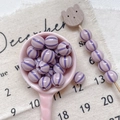 Macro shot of 8-10mm purple striped round acrylic beads for DIY handmade jewelry crafting - Style 4 Purple Striped 10mm