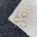 Macro shot of iridescent snail-shaped glass beads for DIY jewelry making and crafts - Pale Yellow Conch