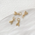 Detailed view of four 14k gold-plated mermaid tail charms with sparkling zircon stone - Small Fishtail / Gold