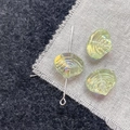 Detailed macro view of light green shell-textured glass beads with aurora AB coating for DIY - Light Green Shell