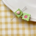 Macro view of green cookie-shaped beads with pink strawberry and sweet engraving - Strawberry Square Plate (12#)