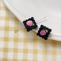 Macro shot of black biscuit charms with pink strawberry and sweet text detail - Strawberry Square Plate (11#)