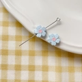 Detail of light blue enamel flower charms with eye pin on a white ceramic plate - Five-Petal Flower (7#)