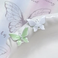 Dettaglio di ciondoli a farfalla in smalto verde e bianco con perle per gioielli fai-da-te - Farfalla Perla Verde Bordo Bianco