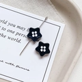 Macro detail of star shaped enamel beads with white polka dots for DIY jewelry making - Star Shape - Black