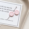Detailed macro view of pink resin button charms for DIY jewelry making and phone chains - Round-Pink