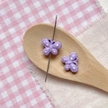 Macro shot of purple butterfly beads with polka dots for DIY jewelry making - Purple Dotted Butterfly