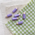 Detailed view of purple pencil-shaped DIY beads for handmade bracelets and crafts - Purple