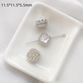 Macro view of clover-shaped shell charm with micro-pave crystals and floral hollow back - White Shell Domed Clover-White Gold Plated