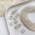 Close-up of Czech glass beads with gold sun pattern for DIY jewelry making - Rounded Cube (2#) / Clear