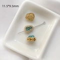 Macro detail of a 11.5x9.5mm gourd-shaped charm with green gemstone and gold plating - Gold Plated Blue-Green Gourd