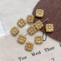Macro shot of square vintage gold flower beads for DIY jewelry with antique finish - 17#