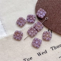 Close-up of purple Czech glass square flower beads with vintage Picasso finish for DIY - Size 11