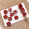 Macro detail of red marble texture glass flower beads for DIY jewelry making - Red