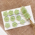 Macro view of translucent light green floral glass beads with central hole for DIY jewelry - 4# Clear Green