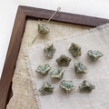 Macro detail of handmade floral ceramic beads with glazed blue and brown textures - 4# Retro Hand-painted Green