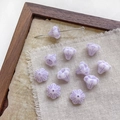 Macro shot of purple striped morning glory glass beads and metal pin on linen fabric - 3# Purple