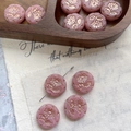 Detailed macro view of pink glass beads with floral relief and golden edges on wood - Vintage Pink With Gold (17#)