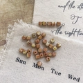 Macro shot of square Picasso glass beads with vintage brown marble swirls for DIY crafts - 5#