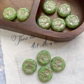 Macro view of vintage green daisy beads with gold flower engraving on a wooden tray - Light Green With Gold (13#)