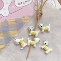 Detailed view of white resin puppy beads with yellow plaid patterns for DIY crafts - Yellow Plaid Puppy