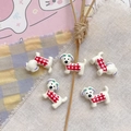 Macro detail of five cute resin puppy charms with red checkered patterns for DIY jewelry - Red Plaid Puppy