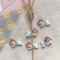 Macro shot of cute cartoon dog resin charms with hats for DIY jewelry and crafts - Khaki Hat Puppy