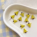 Detail of yellow tree-shaped beads with black polka dots for DIY jewelry making - 12# Tree-Yellow