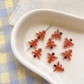 Detailed view of orange tree-shaped alloy beads for DIY jewelry with leaf vein patterns - 10# Tree-Orange