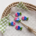 Detailed view of handmade colorful glass fish beads with polka dots in a wicker basket - 8# Polka Dot - Rose Pink Head Green Tail