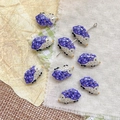 Dettaglio di perline a forma di riccio viola in resina per la creazione di gioielli - Riccio Viola Grigio