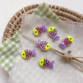 Detailed view of colorful glass fish beads with hand-painted patterns for DIY jewelry - 4# Striped - Yellow Head Purple Tail