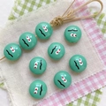 Detail of mint green round beads with funny facial print for DIY mobile phone straps - Green-Round