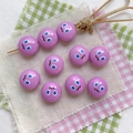 Detailed view of purple acrylic beads with cute cartoon faces for DIY phone strap jewelry - Purple-Round