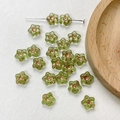 Detailed macro of pale green Czech glass flower beads for handmade jewelry DIY projects - Transparent Light Green Five-Petal Flower Style(3#)-1 Piece