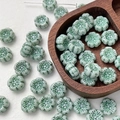 Detailed view of light green flower-shaped Czech glass beads for DIY jewelry making - 1 Piece / Light Green