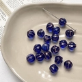 Close-up of dark blue Czech glass pumpkin beads with gold engraved lines for DIY jewelry - 1 Piece / Dark Blue